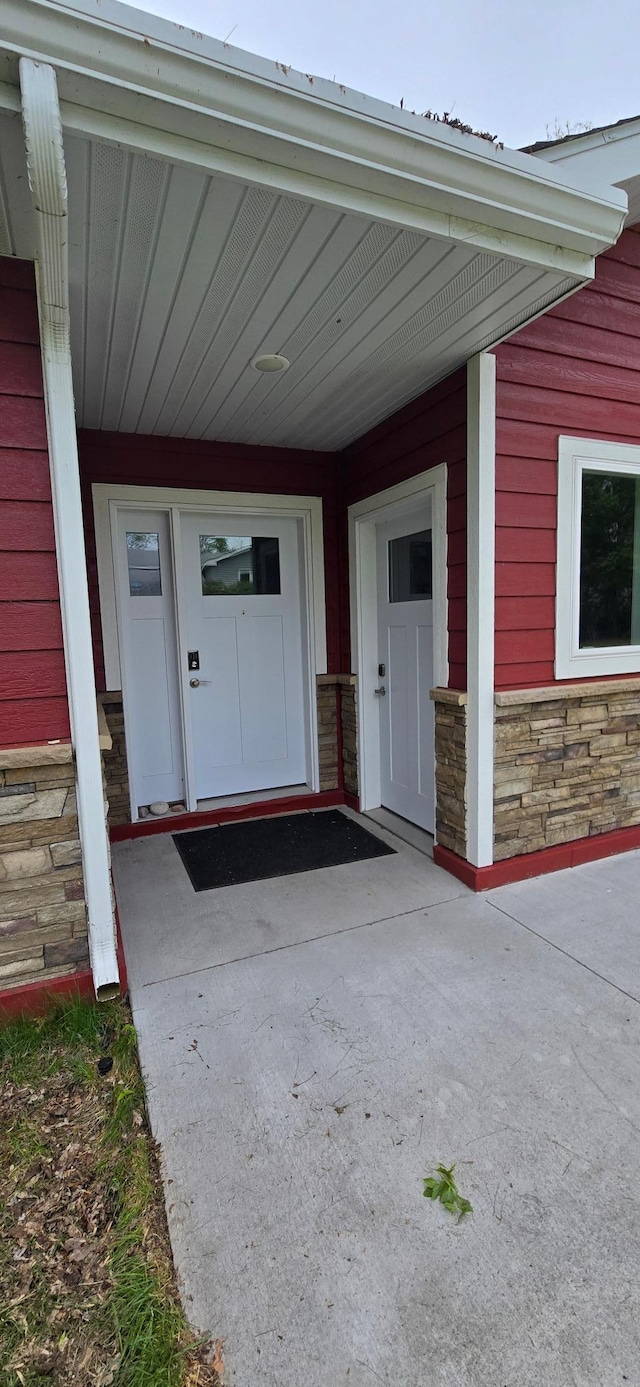 6207 Lagoon Dr NE, Bemidji, MN 56601 - view of exterior entry featuring stone siding