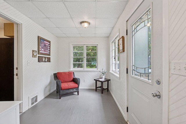 332 2nd St, New Richmond, WI 54017 - sitting room featuring a paneled ceiling, wood finished floors, and baseboards