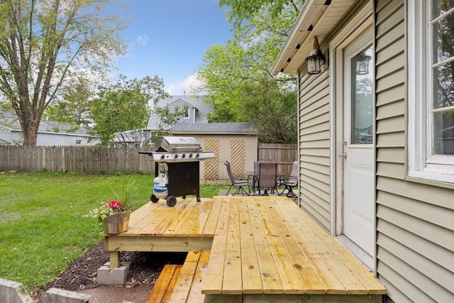 332 2nd St, New Richmond, WI 54017 - wooden terrace featuring outdoor dining area and a grill