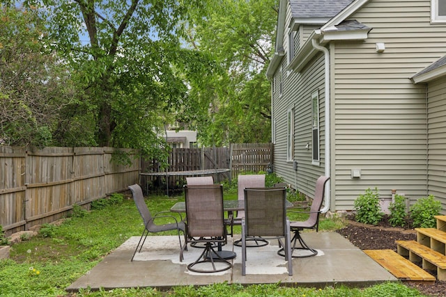 332 2nd St, New Richmond, WI 54017 - fenced backyard with a patio area and outdoor dining area