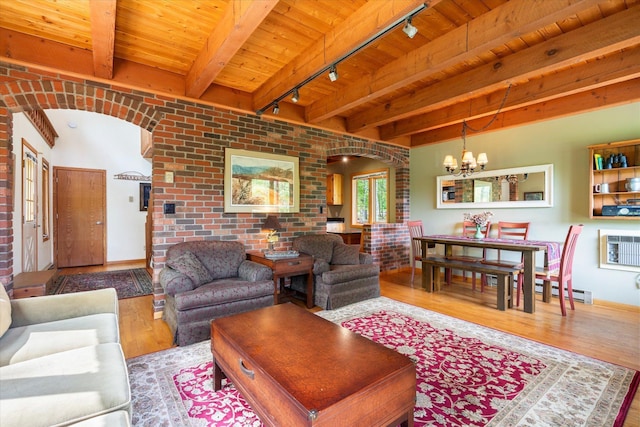 11690 Harbor Ln, Ideal Twp, MN 56442 - living area with rail lighting, arched walkways, wood finished floors, wooden ceiling with exposed beams, and a chandelier