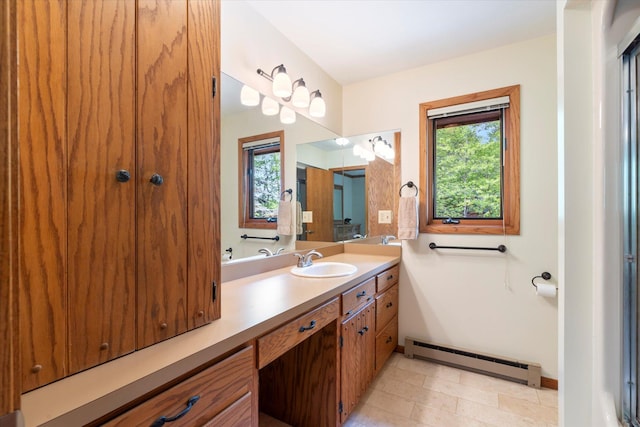 11690 Harbor Ln, Ideal Twp, MN 56442 - bathroom with baseboard heating, baseboards, vanity, and stone finish floors