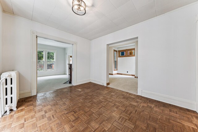 492 Dayton Ave, Saint Paul, MN 55102 - empty room with radiator and ornamental molding
