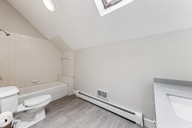 492 Dayton Ave, Saint Paul, MN 55102 - full bathroom with a baseboard radiator, lofted ceiling, a skylight, vanity, and bathtub / shower combination