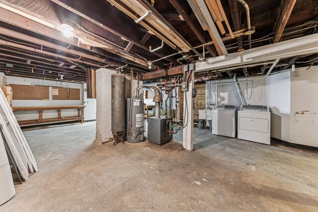 492 Dayton Ave, Saint Paul, MN 55102 - unfinished below grade area with water heater, washing machine and clothes dryer, and a heating unit
