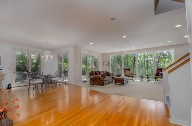 6323 Timber Trl, Edina, MN 55439 - living area featuring healthy amount of natural light, a chandelier, recessed lighting, and wood finished floors