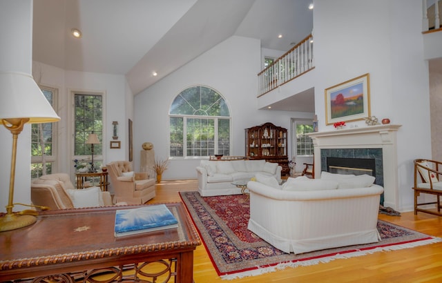 6323 Timber Trl, Edina, MN 55439 - living room featuring wood finished floors, plenty of natural light, a high end fireplace, high vaulted ceiling, and recessed lighting