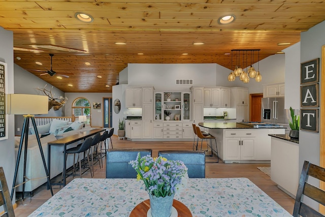 8081 45th Ave SW, Raymond, MN 56282 - dining space with wooden ceiling, a ceiling fan, high vaulted ceiling, recessed lighting, and light wood-style floors