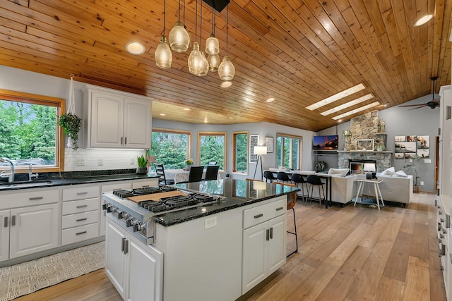8081 45th Ave SW, Raymond, MN 56282 - kitchen with stainless steel gas cooktop, a ceiling fan, plenty of natural light, wooden ceiling, and vaulted ceiling