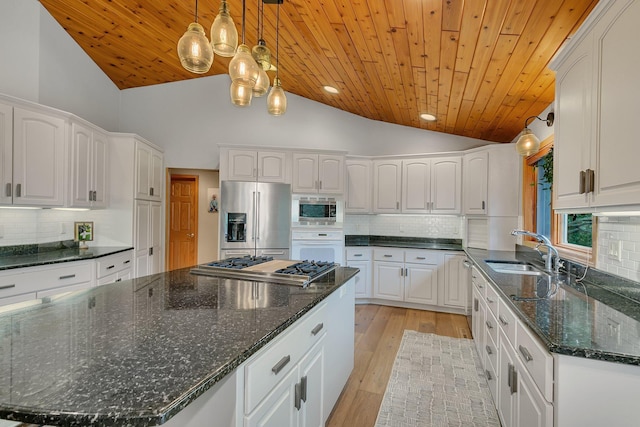 8081 45th Ave SW, Raymond, MN 56282 - kitchen with appliances with stainless steel finishes, a sink, lofted ceiling, wood ceiling, and a center island
