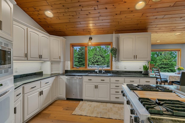 8081 45th Ave SW, Raymond, MN 56282 - kitchen featuring stainless steel appliances, wood ceiling, recessed lighting, a sink, and backsplash