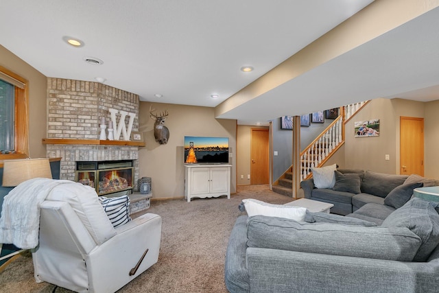 8081 45th Ave SW, Raymond, MN 56282 - carpeted living room featuring stairs, a brick fireplace, recessed lighting, and baseboards