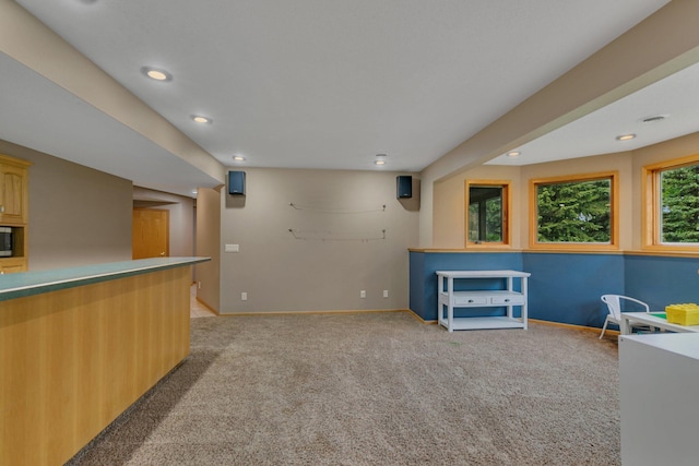 8081 45th Ave SW, Raymond, MN 56282 - bar with light carpet, stainless steel microwave, recessed lighting, and baseboards
