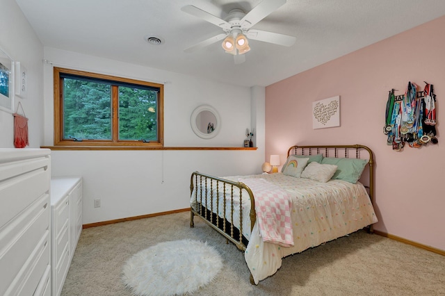 8081 45th Ave SW, Raymond, MN 56282 - bedroom featuring light carpet, baseboards, and a ceiling fan