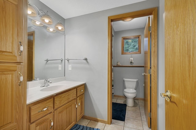 8081 45th Ave SW, Raymond, MN 56282 - bathroom featuring vanity, toilet, tile patterned flooring, and baseboards