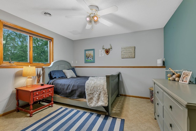 8081 45th Ave SW, Raymond, MN 56282 - bedroom featuring light colored carpet, baseboards, and ceiling fan