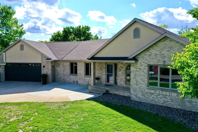 8081 45th Ave SW, Raymond, MN 56282 - view of front of house with a garage, driveway, a front lawn, a porch, and brick siding