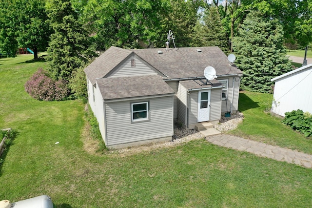 8081 45th Ave SW, Raymond, MN 56282 - view of front facade featuring a shingled roof and a front lawn