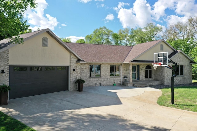 8081 45th Ave SW, Raymond, MN 56282 - single story home with concrete driveway, roof with shingles, a garage, and brick siding