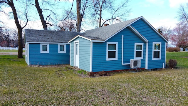 115 Mn Highway 78 N, Ottertail, MN 56571 - view of home's exterior featuring a cooling unit, a shingled roof, a lawn, and a chimney