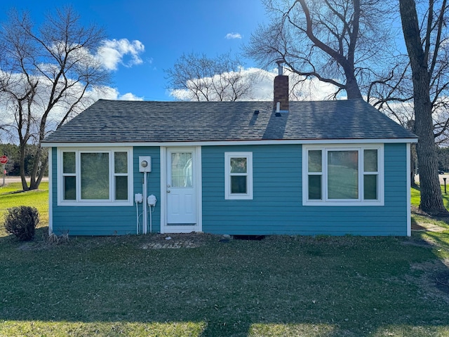 115 Mn Highway 78 N, Ottertail, MN 56571 - bungalow-style home featuring a chimney, a front yard, and roof with shingles