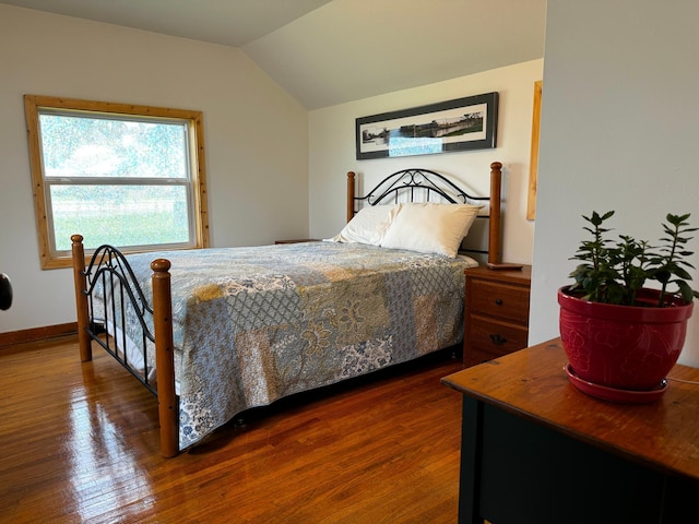 115 Mn Highway 78 N, Ottertail, MN 56571 - bedroom with vaulted ceiling, wood finished floors, and baseboards