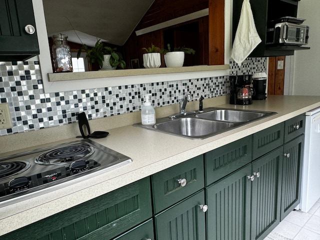 115 Mn Highway 78 N, Ottertail, MN 56571 - kitchen featuring green cabinets, vaulted ceiling, a sink, light countertops, and decorative backsplash