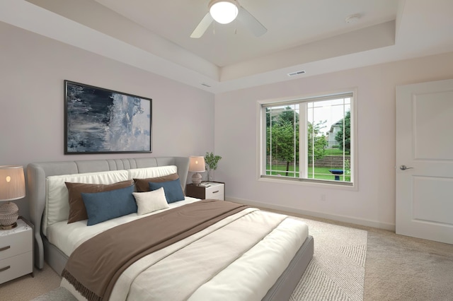 8800 Upper 7th Pl, Lake Elmo, MN 55042 - bedroom with light colored carpet, a raised ceiling, and ceiling fan