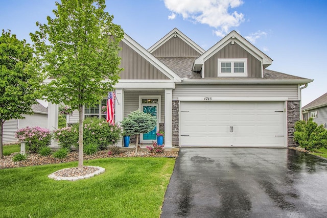 4745 Copper Cir, Woodbury, MN 55129 - craftsman-style home with driveway, board and batten siding, a front lawn, stone siding, and a garage