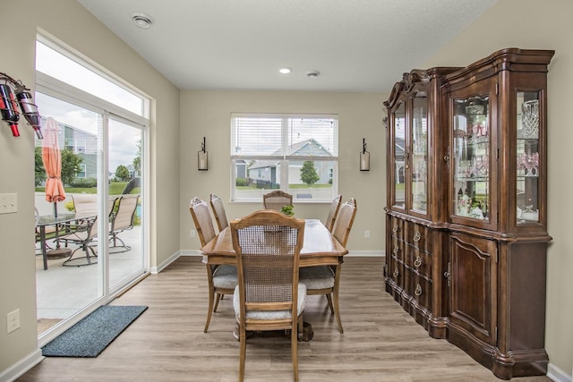 4745 Copper Cir, Woodbury, MN 55129 - dining room featuring light wood-type flooring and recessed lighting
