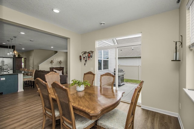 4745 Copper Cir, Woodbury, MN 55129 - dining room featuring dark wood-type flooring and recessed lighting