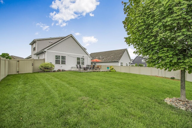 4745 Copper Cir, Woodbury, MN 55129 - back of house featuring a gate, a fenced backyard, and a patio area
