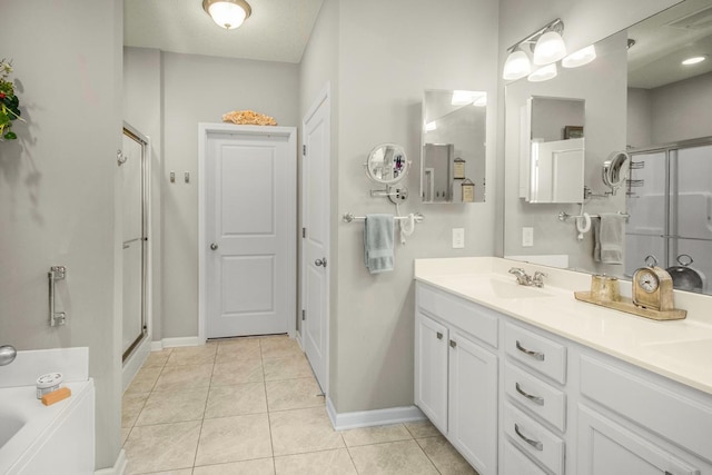 4745 Copper Cir, Woodbury, MN 55129 - full bath with tile patterned flooring, a stall shower, double vanity, and a bath
