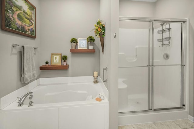 4745 Copper Cir, Woodbury, MN 55129 - full bathroom featuring a stall shower, a bath, and tile patterned flooring