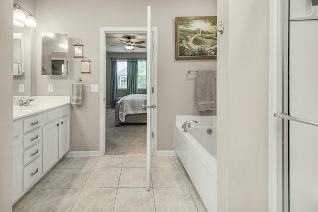 4745 Copper Cir, Woodbury, MN 55129 - bathroom featuring vanity, a ceiling fan, ensuite bath, a bath, and tile patterned flooring