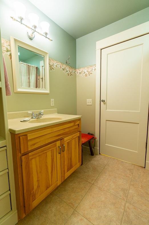 N12011 County Road Ss, Otter Creek Twp, WI 54772 - bathroom featuring vanity and tile patterned floors