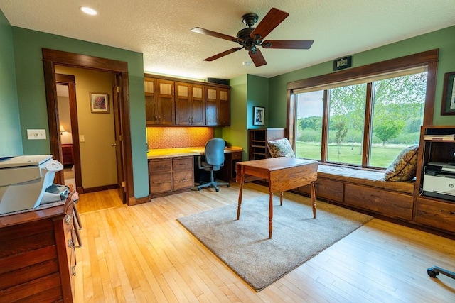 N12011 County Road Ss, Otter Creek Twp, WI 54772 - home office featuring ceiling fan, light wood-style floors, recessed lighting, built in desk, and baseboards