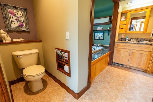 N12011 County Road Ss, Otter Creek Twp, WI 54772 - bathroom with toilet, vanity, tile patterned floors, and baseboards