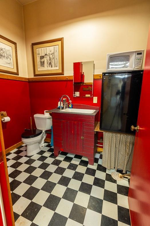 N12011 County Road Ss, Otter Creek Twp, WI 54772 - bathroom with toilet, tile patterned floors, and vanity