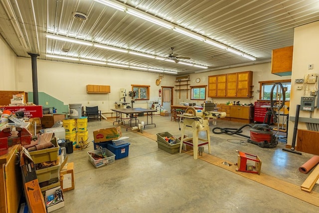 N12011 County Road Ss, Otter Creek Twp, WI 54772 - garage featuring a workshop area and a ceiling fan