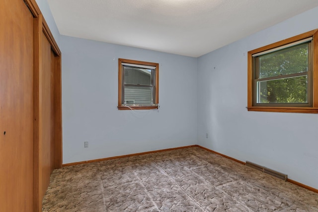 16736 County Road 49, Cold Spring, MN 56320 - unfurnished bedroom featuring a closet and baseboards