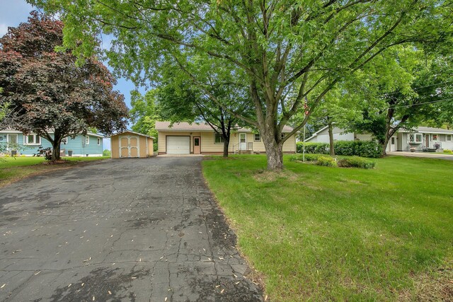 16736 County Road 49, Cold Spring, MN 56320 - ranch-style home featuring driveway, an attached garage, and a front yard