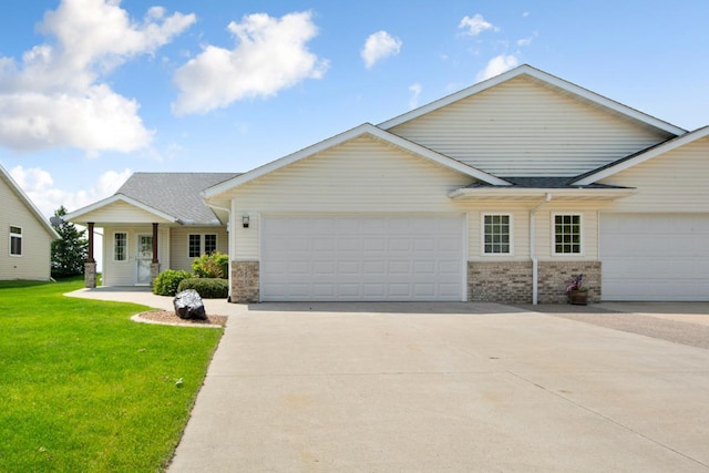 2475 Mossy Creek Dr NE, Owatonna, MN 55060 - single story home with an attached garage, a front lawn, driveway, and brick siding