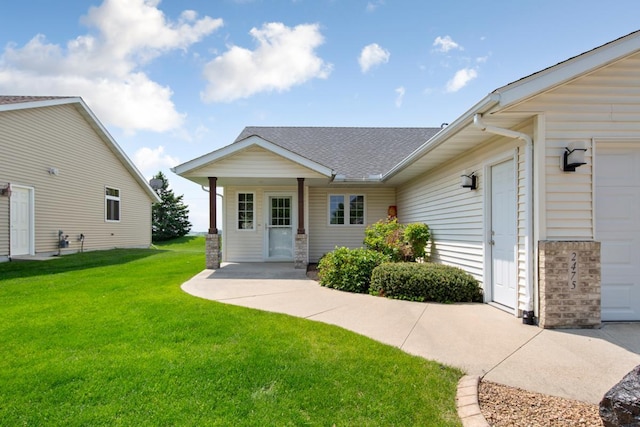 2475 Mossy Creek Dr NE, Owatonna, MN 55060 - view of front of house featuring a front yard, a shingled roof, and an attached garage
