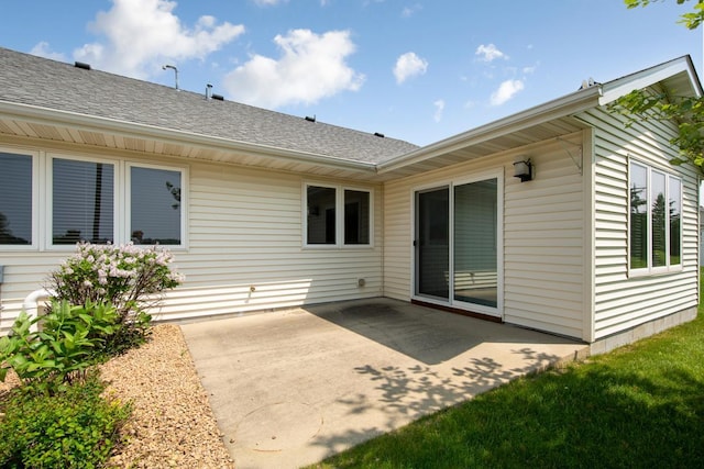 2475 Mossy Creek Dr NE, Owatonna, MN 55060 - rear view of house featuring a patio area and roof with shingles