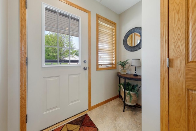 2475 Mossy Creek Dr NE, Owatonna, MN 55060 - doorway to outside featuring baseboards