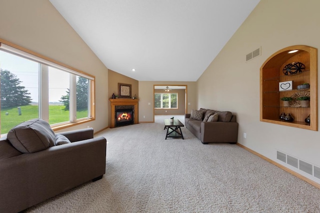 2475 Mossy Creek Dr NE, Owatonna, MN 55060 - living room with a fireplace, high vaulted ceiling, carpet, and arched walkways
