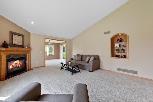 2475 Mossy Creek Dr NE, Owatonna, MN 55060 - carpeted living room with vaulted ceiling, a fireplace, ceiling fan, and recessed lighting