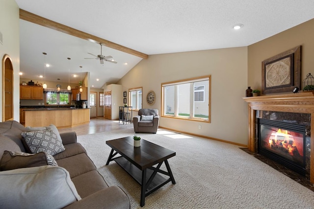 2475 Mossy Creek Dr NE, Owatonna, MN 55060 - living room with a fireplace with flush hearth, recessed lighting, light carpet, and a ceiling fan