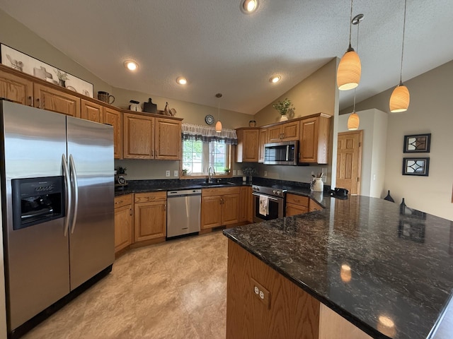 2475 Mossy Creek Dr NE, Owatonna, MN 55060 - kitchen featuring stainless steel appliances, a peninsula, lofted ceiling, hanging light fixtures, and brown cabinetry